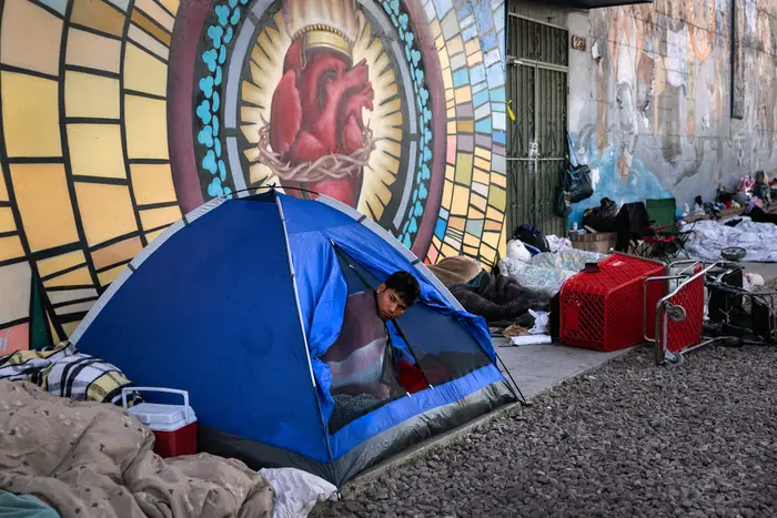 Migrants from the Southern border camp in tents on the street in El Paso, Texas.
